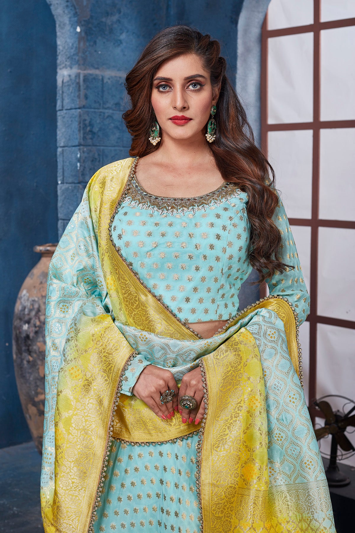 Buy gorgeous light blue embroidered designer lehenga online in USA with yellow dupatta. Get set for weddings and festive occasions in exclusive designer Anarkali suits, wedding gown, salwar suits, gharara suits, Indowestern dresses from Pure Elegance Indian fashion store in USA.-closeup