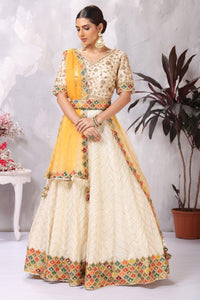 Shop gorgeous off-white embroidered belted designer lehenga online in USA. Be the center of attraction on special occasion in beautiful designer lehengas, bridal lehengas, palazzo suits, sharara suits, Anarkali suits, gowns from Pure Elegance Indian fashion store in USA.-front