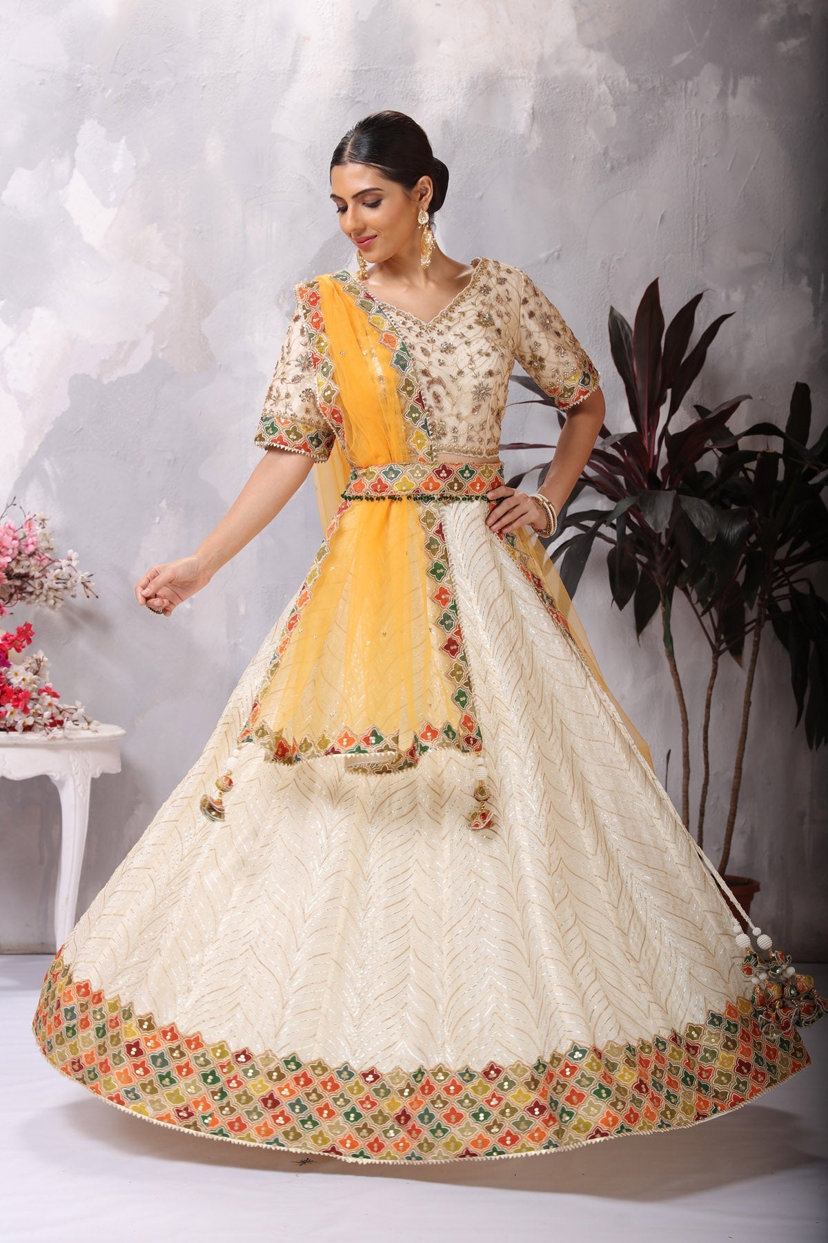 Shop gorgeous off-white embroidered belted designer lehenga online in USA. Be the center of attraction on special occasion in beautiful designer lehengas, bridal lehengas, palazzo suits, sharara suits, Anarkali suits, gowns from Pure Elegance Indian fashion store in USA.-full view