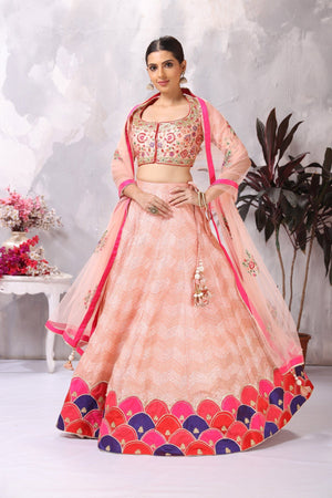 Buy stunning light pink embroidered designer lehenga online in USA. Be the center of attraction on special occasion in beautiful designer lehengas, bridal lehengas, palazzo suits, sharara suits, Anarkali suits, gowns from Pure Elegance Indian fashion store in USA.-front