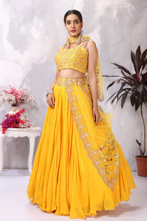 Buy stunning yellow embroidered designer lehenga online in USA with dupatta. Be the center of attraction on special occasion in beautiful designer lehengas, bridal lehengas, palazzo suits, sharara suits, Anarkali suits, gowns from Pure Elegance Indian fashion store in USA.-side