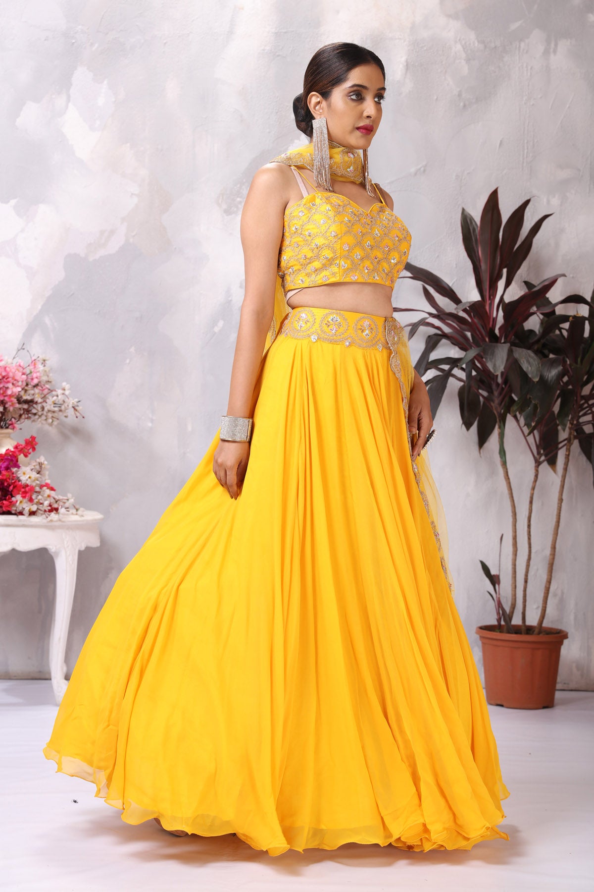 Buy stunning yellow embroidered designer lehenga online in USA with dupatta. Be the center of attraction on special occasion in beautiful designer lehengas, bridal lehengas, palazzo suits, sharara suits, Anarkali suits, gowns from Pure Elegance Indian fashion store in USA.-right