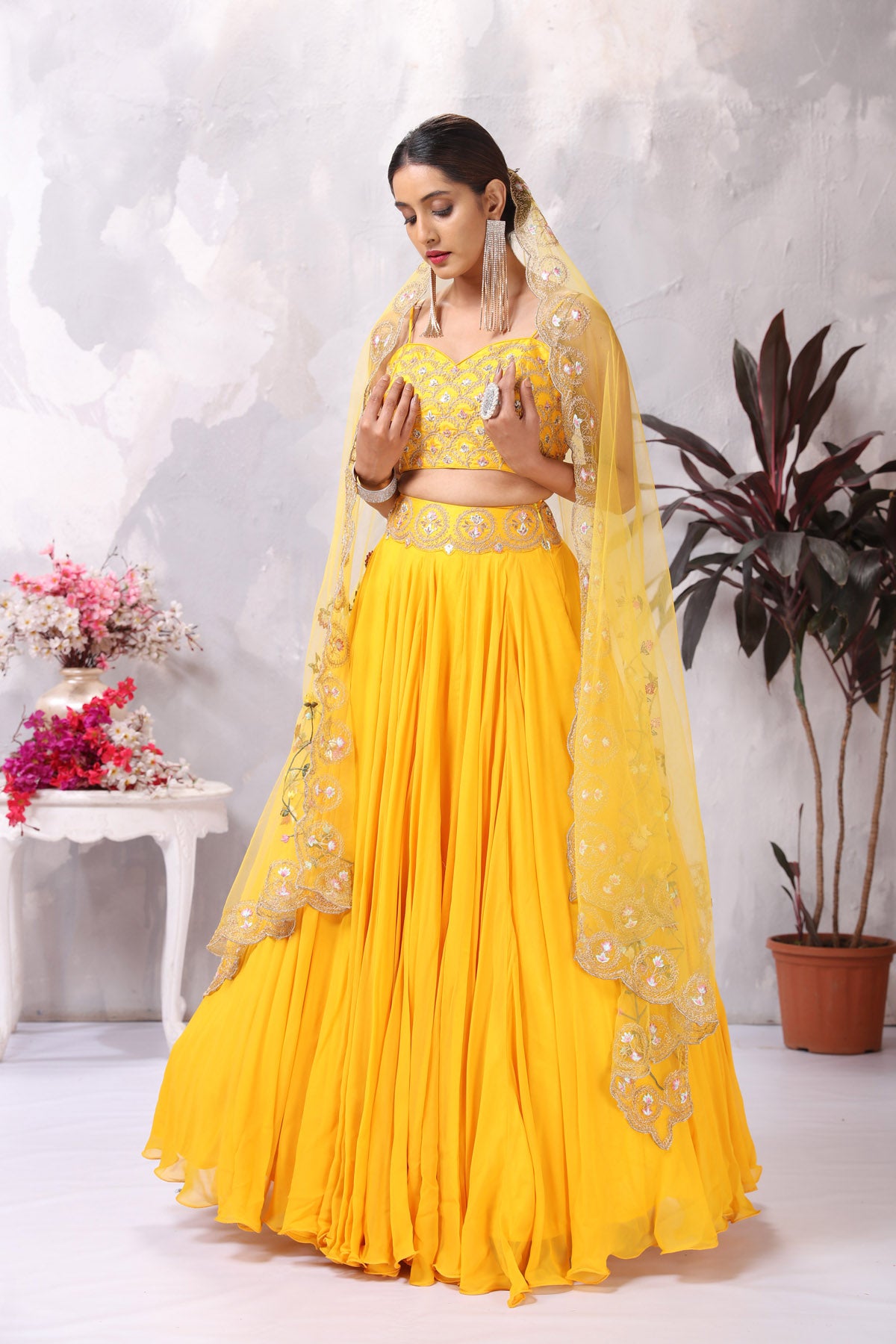 Buy stunning yellow embroidered designer lehenga online in USA with dupatta. Be the center of attraction on special occasion in beautiful designer lehengas, bridal lehengas, palazzo suits, sharara suits, Anarkali suits, gowns from Pure Elegance Indian fashion store in USA.-front