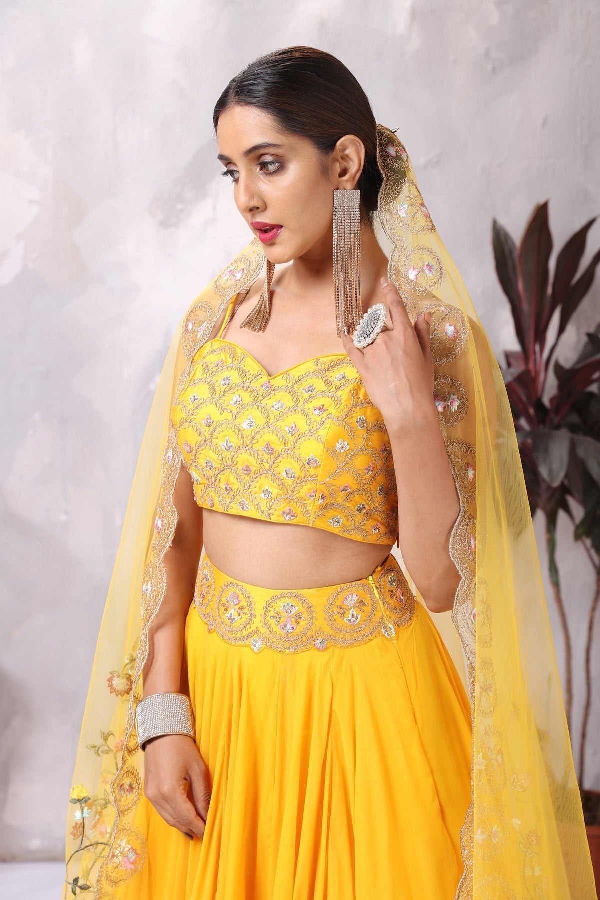 Buy stunning yellow embroidered designer lehenga online in USA with dupatta. Be the center of attraction on special occasion in beautiful designer lehengas, bridal lehengas, palazzo suits, sharara suits, Anarkali suits, gowns from Pure Elegance Indian fashion store in USA.-closeup