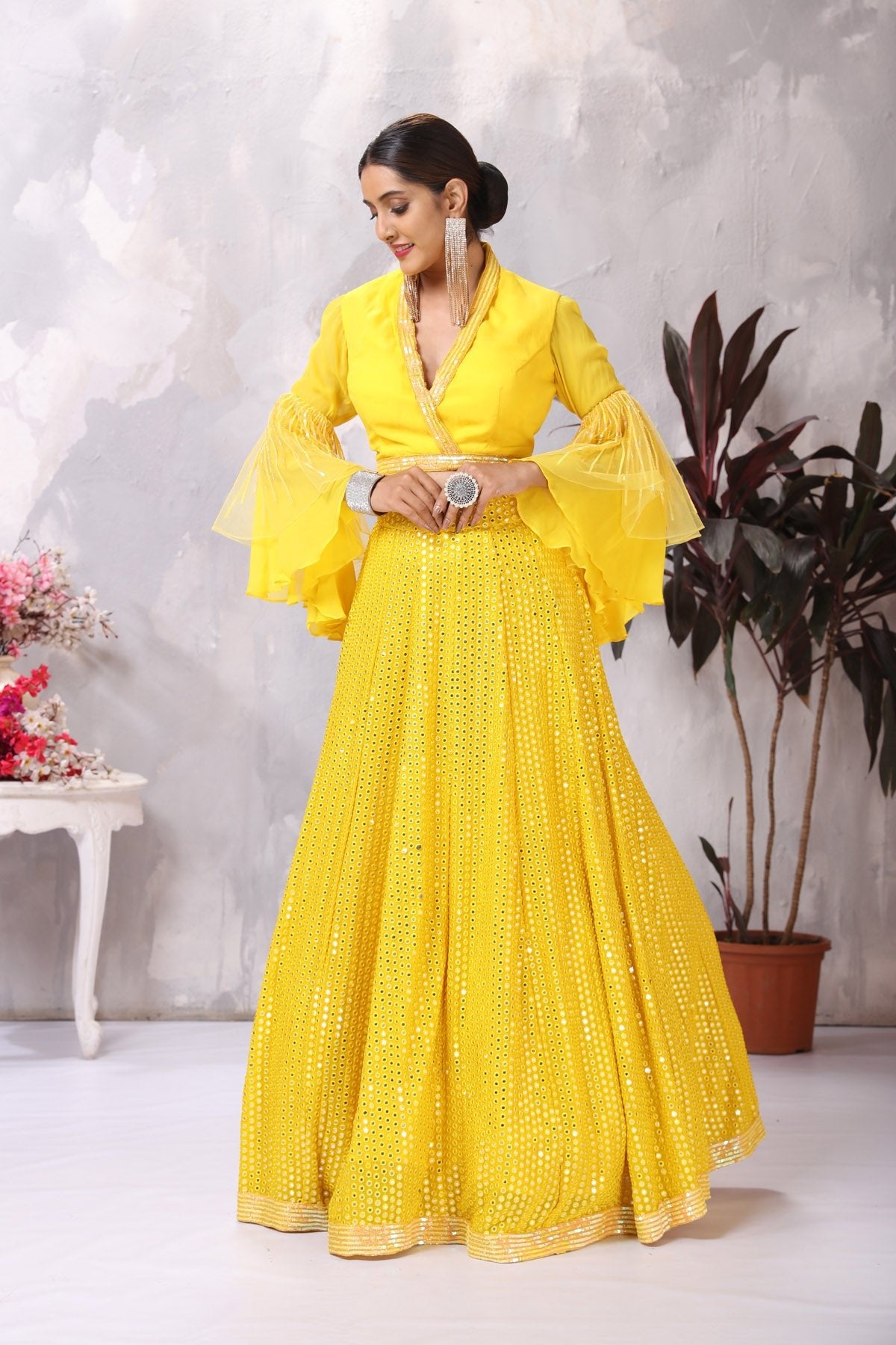 Buy stunning yellow designer lehenga online in USA with bell sleeves blouse. Be the center of attraction on special occasion in beautiful designer lehengas, bridal lehengas, palazzo suits, sharara suits, Anarkali suits, gowns from Pure Elegance Indian fashion store in USA.-front