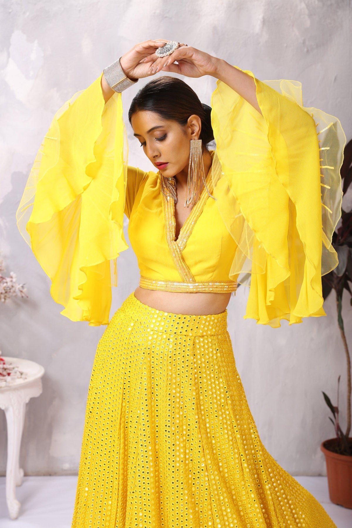 Buy stunning yellow designer lehenga online in USA with bell sleeves blouse. Be the center of attraction on special occasion in beautiful designer lehengas, bridal lehengas, palazzo suits, sharara suits, Anarkali suits, gowns from Pure Elegance Indian fashion store in USA.-closeup