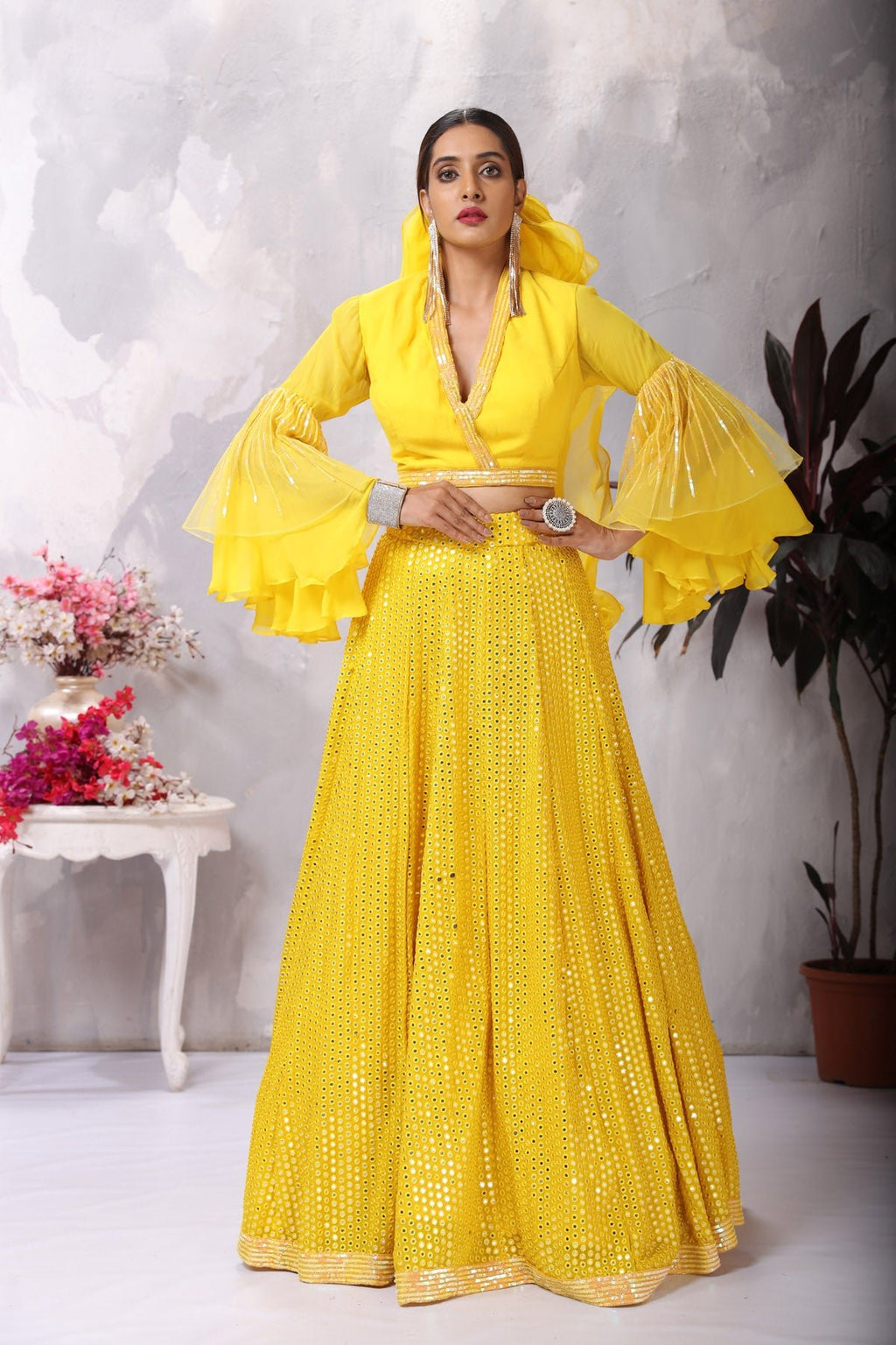 Buy stunning yellow designer lehenga online in USA with bell sleeves blouse. Be the center of attraction on special occasion in beautiful designer lehengas, bridal lehengas, palazzo suits, sharara suits, Anarkali suits, gowns from Pure Elegance Indian fashion store in USA.-full view