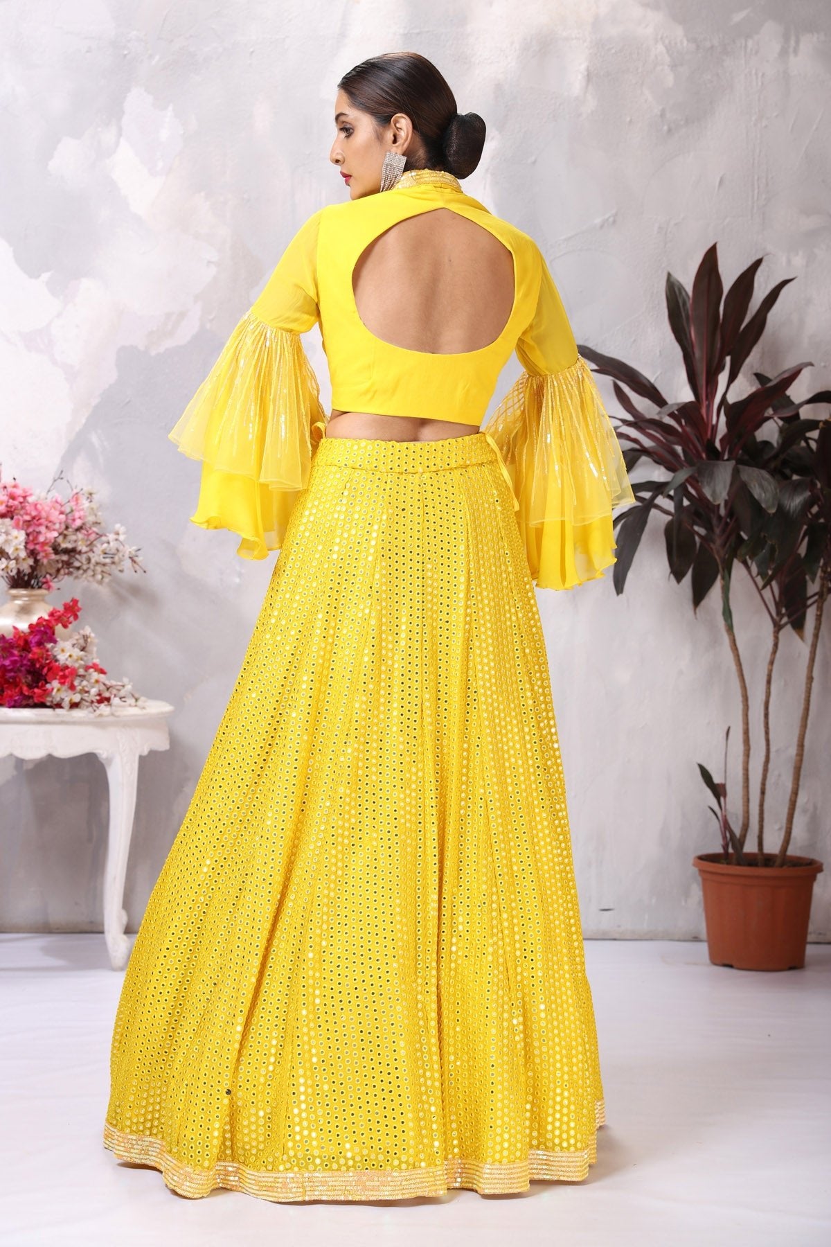 Buy stunning yellow designer lehenga online in USA with bell sleeves blouse. Be the center of attraction on special occasion in beautiful designer lehengas, bridal lehengas, palazzo suits, sharara suits, Anarkali suits, gowns from Pure Elegance Indian fashion store in USA.-back