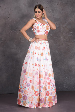Buy stunning white floral embroidered designer lehenga online in USA with dupatta. Radiate ethnic glam on special occasions in beautiful designer lehengas, Anarkali suits, Indowestern dresses, designer gown, salwar suits from Pure Elegance Indian fashion store in USA,-side