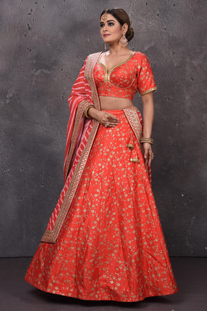 Buy beautiful orange embroidered designer lehenga with striped dupatta. Look royal at weddings in this bespoke designer lehengas, wedding gowns, bridal lehengas, designer sarees, Anarkali suits, sharara suits, from Pure Elegance Indian fashion store in USA.-side