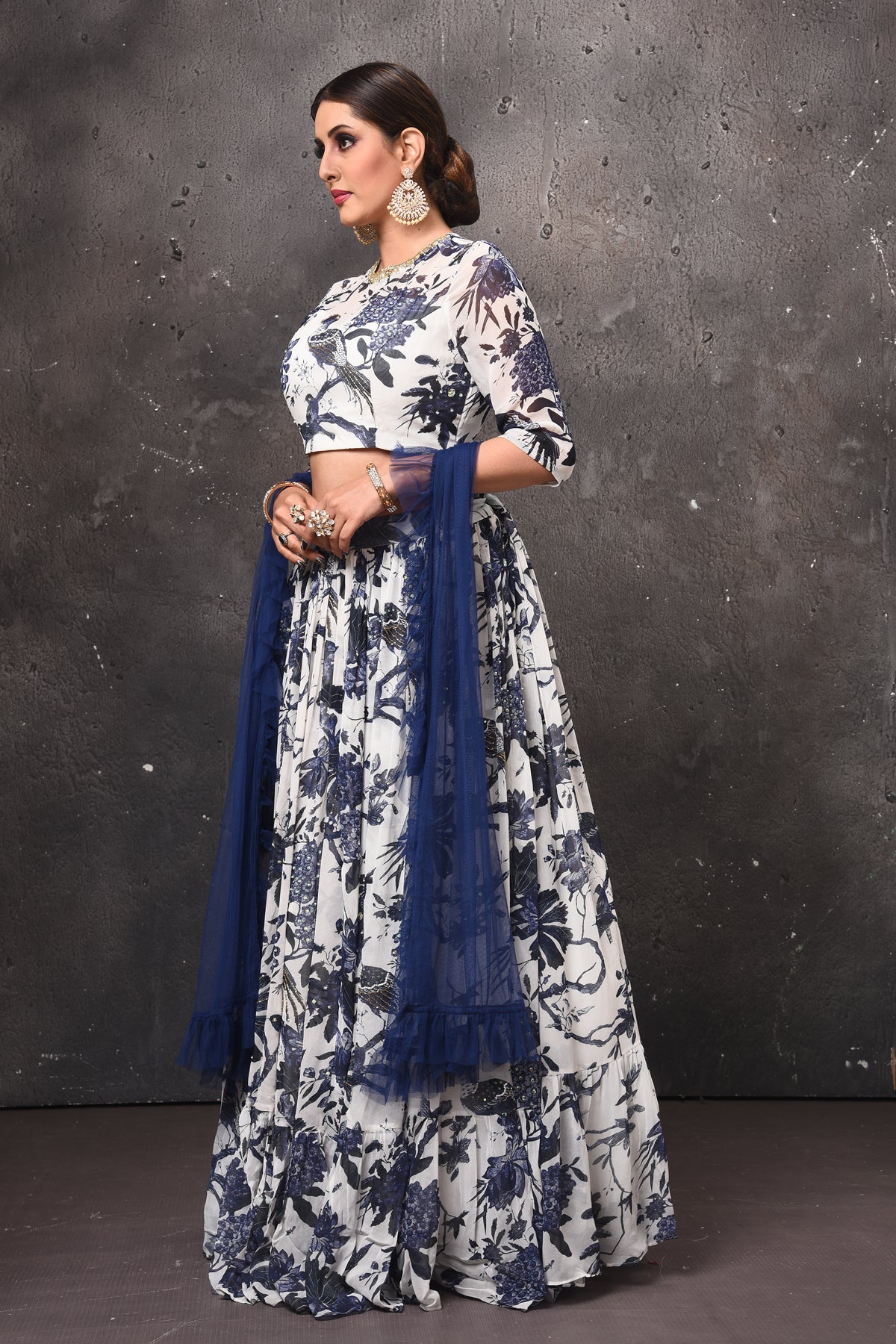 Buy beautiful white and blue printed lehenga online in USA with blue dupatta. Get set for weddings and festive occasions in exclusive designer Anarkali suits, wedding gown, salwar suits, gharara suits, Indowestern dresses from Pure Elegance Indian fashion store in USA.-left