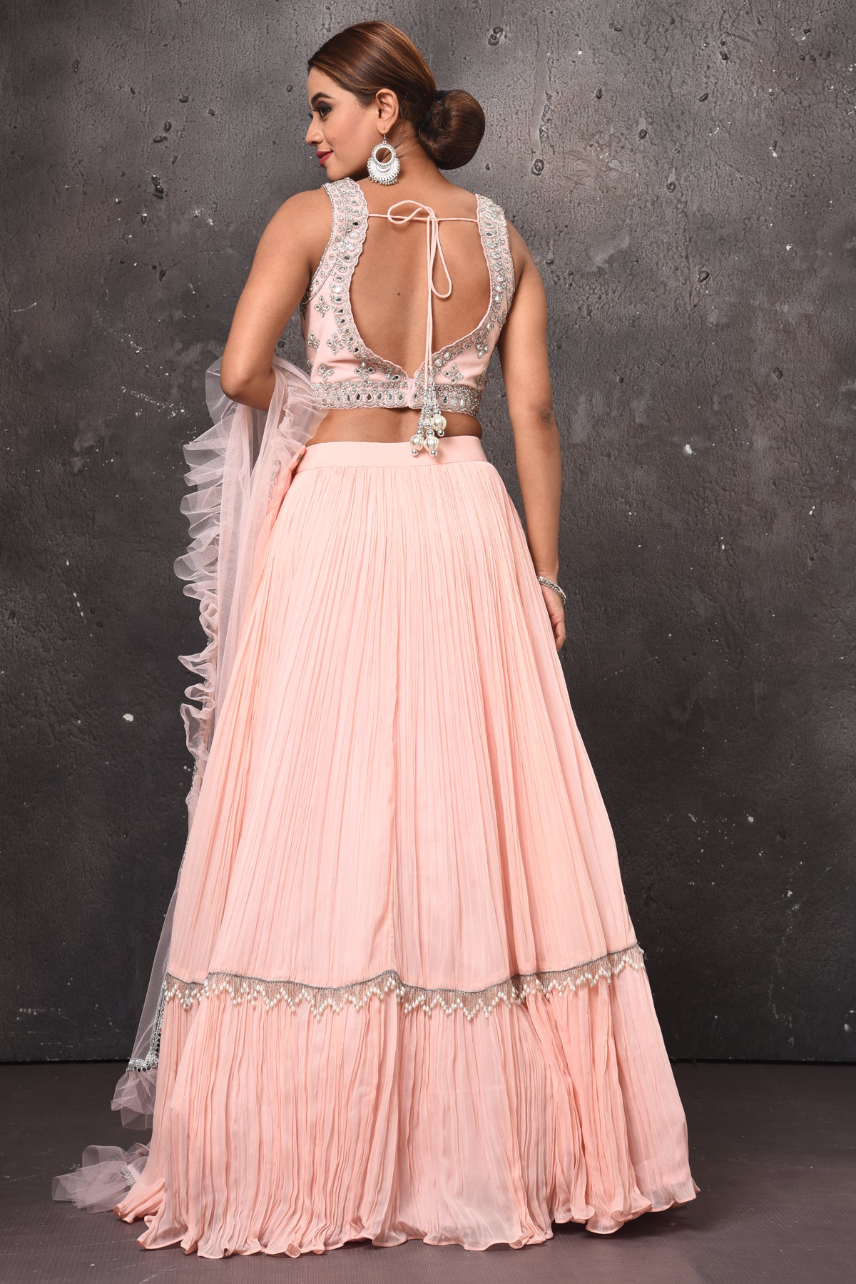 Buy stunning powder pink mirror work designer lehenga online in USA with dupatta. Get set for weddings and festive occasions in exclusive designer Anarkali suits, wedding gown, salwar suits, gharara suits, Indowestern dresses from Pure Elegance Indian fashion store in USA.-back