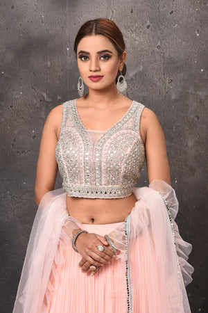Buy stunning powder pink mirror work designer lehenga online in USA with dupatta. Get set for weddings and festive occasions in exclusive designer Anarkali suits, wedding gown, salwar suits, gharara suits, Indowestern dresses from Pure Elegance Indian fashion store in USA.-closeup