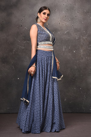 Shop stunning blue printed lehenga online in USA with embellished belt. Get set for weddings and festive occasions in exclusive designer Anarkali suits, wedding gown, salwar suits, gharara suits, Indowestern dresses from Pure Elegance Indian fashion store in USA.-side