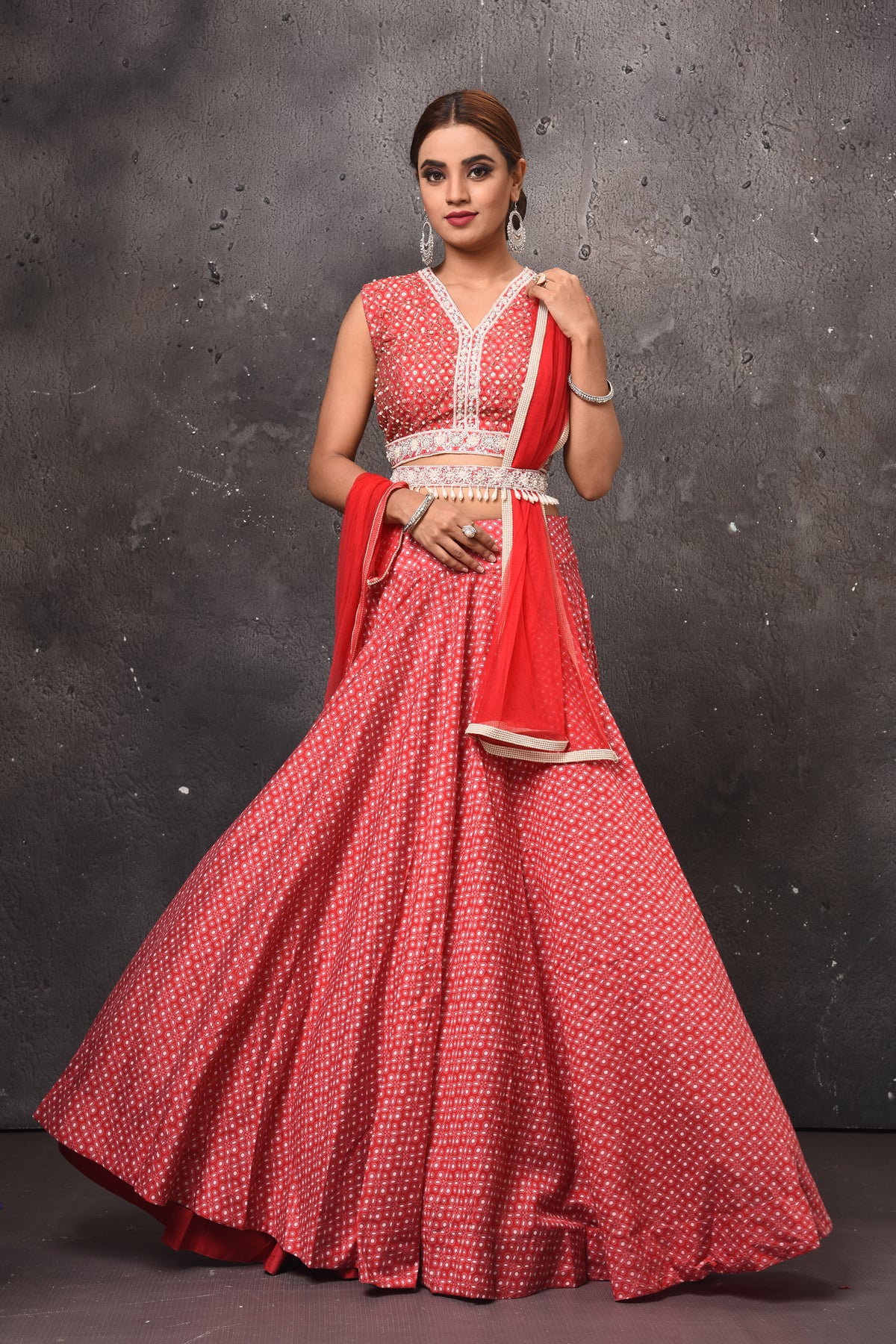 Buy stunning red printed lehenga online in USA with embellished belt. Get set for weddings and festive occasions in exclusive designer Anarkali suits, wedding gown, salwar suits, gharara suits, Indowestern dresses from Pure Elegance Indian fashion store in USA.-full view