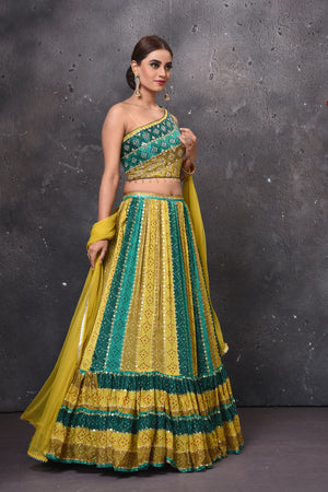 Buy beautiful green shaded stripes lehenga online in USA with dupatta. Get set for weddings and festive occasions in exclusive designer Anarkali suits, wedding gown, salwar suits, gharara suits, Indowestern dresses from Pure Elegance Indian fashion store in USA.-side