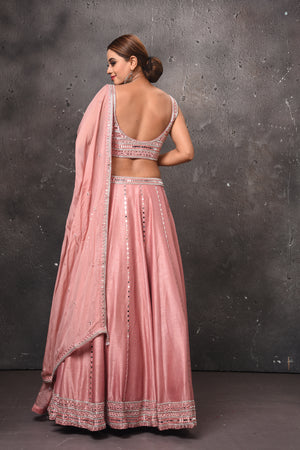 Shop stunning dusty pink mirror work belted lehenga online in USA with dupatta. Get set for weddings and festive occasions in exclusive designer Anarkali suits, wedding gown, salwar suits, gharara suits, Indowestern dresses from Pure Elegance Indian fashion store in USA.-back