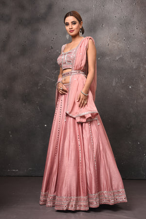 Shop stunning dusty pink mirror work belted lehenga online in USA with dupatta. Get set for weddings and festive occasions in exclusive designer Anarkali suits, wedding gown, salwar suits, gharara suits, Indowestern dresses from Pure Elegance Indian fashion store in USA.-side