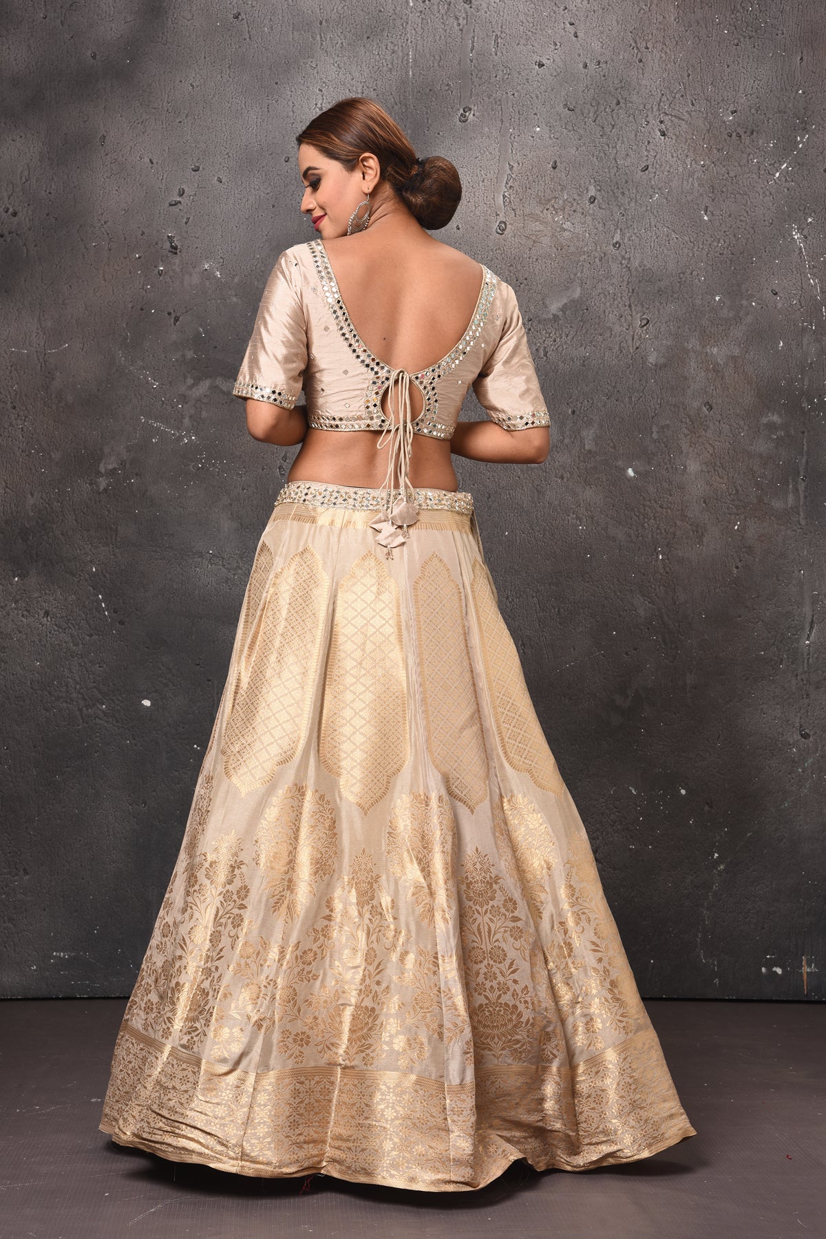 Buy stunning golden embroidered designer lehenga online in USA with pink dupatta. Get set for weddings and festive occasions in exclusive designer Anarkali suits, wedding gown, salwar suits, gharara suits, Indowestern dresses from Pure Elegance Indian fashion store in USA.-back