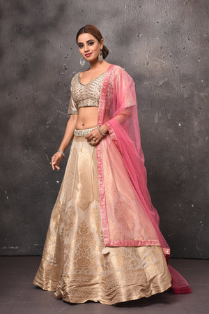 Buy stunning golden embroidered designer lehenga online in USA with pink dupatta. Get set for weddings and festive occasions in exclusive designer Anarkali suits, wedding gown, salwar suits, gharara suits, Indowestern dresses from Pure Elegance Indian fashion store in USA.-side