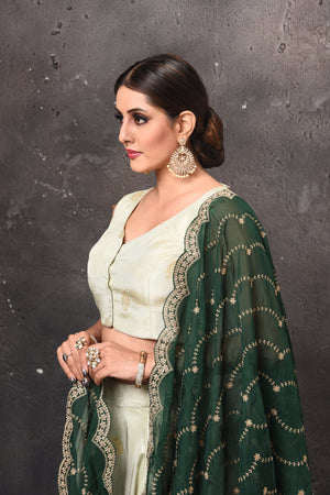 Shop beautiful mint green designer lehenga online in USA with dark green dupatta. Get set for weddings and festive occasions in exclusive designer Anarkali suits, wedding gown, salwar suits, gharara suits, Indowestern dresses from Pure Elegance Indian fashion store in USA.-closeup
