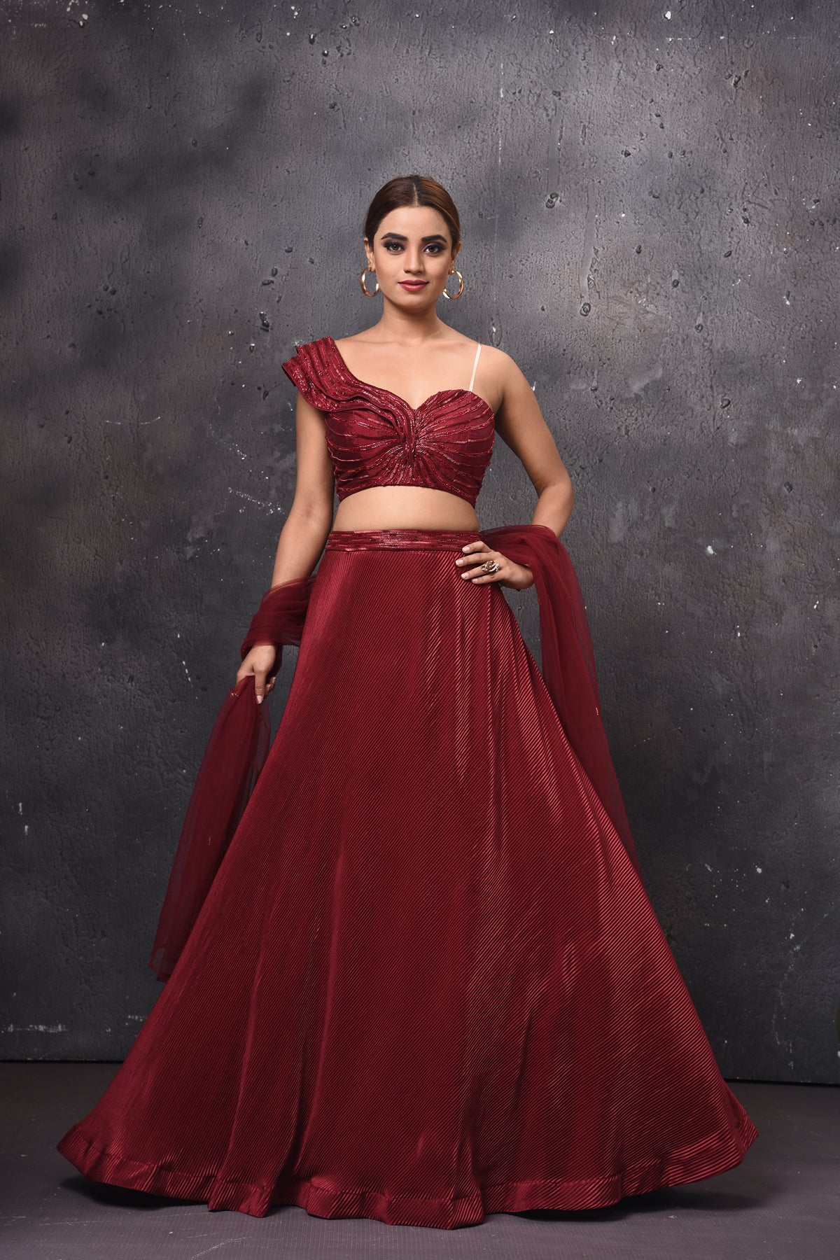 Buy stunning maroon one shoulder contemporary lehenga online in USA with dupatta. Get set for weddings and festive occasions in exclusive designer Anarkali suits, wedding gown, salwar suits, gharara suits, Indowestern dresses from Pure Elegance Indian fashion store in USA.-full view