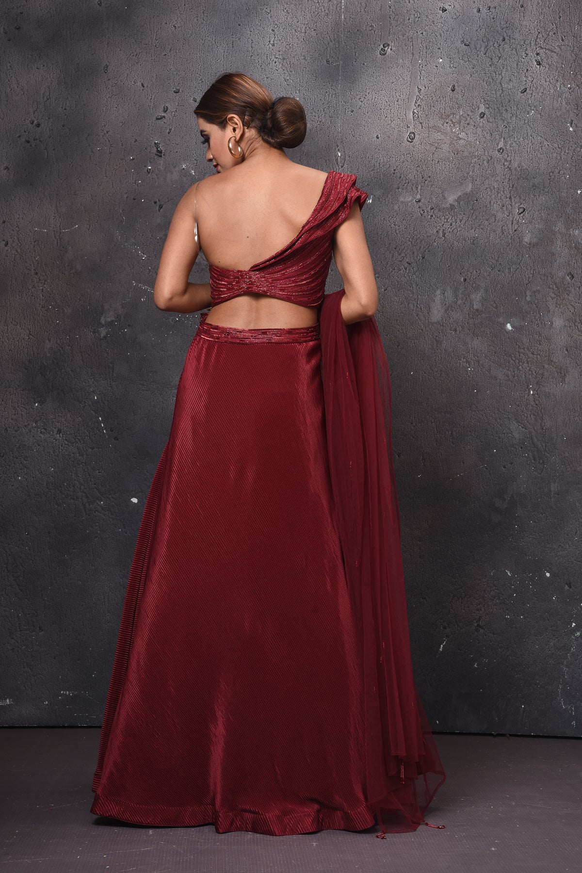 Buy stunning maroon one shoulder contemporary lehenga online in USA with dupatta. Get set for weddings and festive occasions in exclusive designer Anarkali suits, wedding gown, salwar suits, gharara suits, Indowestern dresses from Pure Elegance Indian fashion store in USA.-back