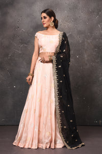 Buy beautiful peach designer lehenga online in USA with black embroidered dupatta. Get set for weddings and festive occasions in exclusive designer Anarkali suits, wedding gown, salwar suits, gharara suits, Indowestern dresses from Pure Elegance Indian fashion store in USA.-full view