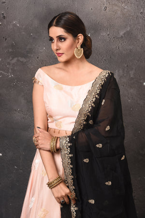 Buy beautiful peach designer lehenga online in USA with black embroidered dupatta. Get set for weddings and festive occasions in exclusive designer Anarkali suits, wedding gown, salwar suits, gharara suits, Indowestern dresses from Pure Elegance Indian fashion store in USA.-closeup
