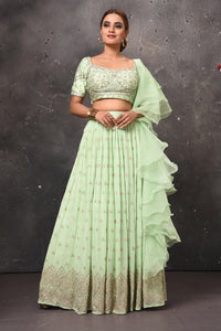 Buy stunning mint green embroidered lehenga online in USA with ruffle dupatta. Get set for weddings and festive occasions in exclusive designer Anarkali suits, wedding gown, salwar suits, gharara suits, Indowestern dresses from Pure Elegance Indian fashion store in USA.-full view