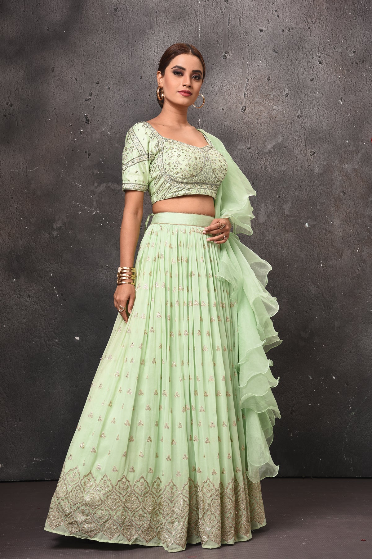 Buy stunning mint green embroidered lehenga online in USA with ruffle dupatta. Get set for weddings and festive occasions in exclusive designer Anarkali suits, wedding gown, salwar suits, gharara suits, Indowestern dresses from Pure Elegance Indian fashion store in USA.-right