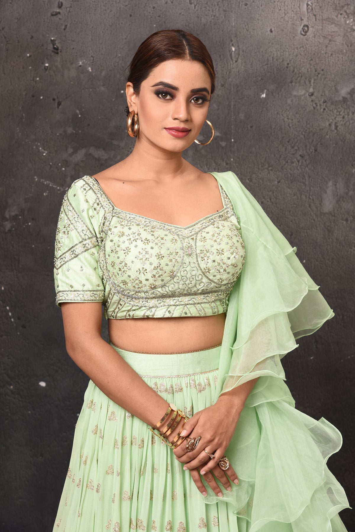 Buy stunning mint green embroidered lehenga online in USA with ruffle dupatta. Get set for weddings and festive occasions in exclusive designer Anarkali suits, wedding gown, salwar suits, gharara suits, Indowestern dresses from Pure Elegance Indian fashion store in USA.-closeup