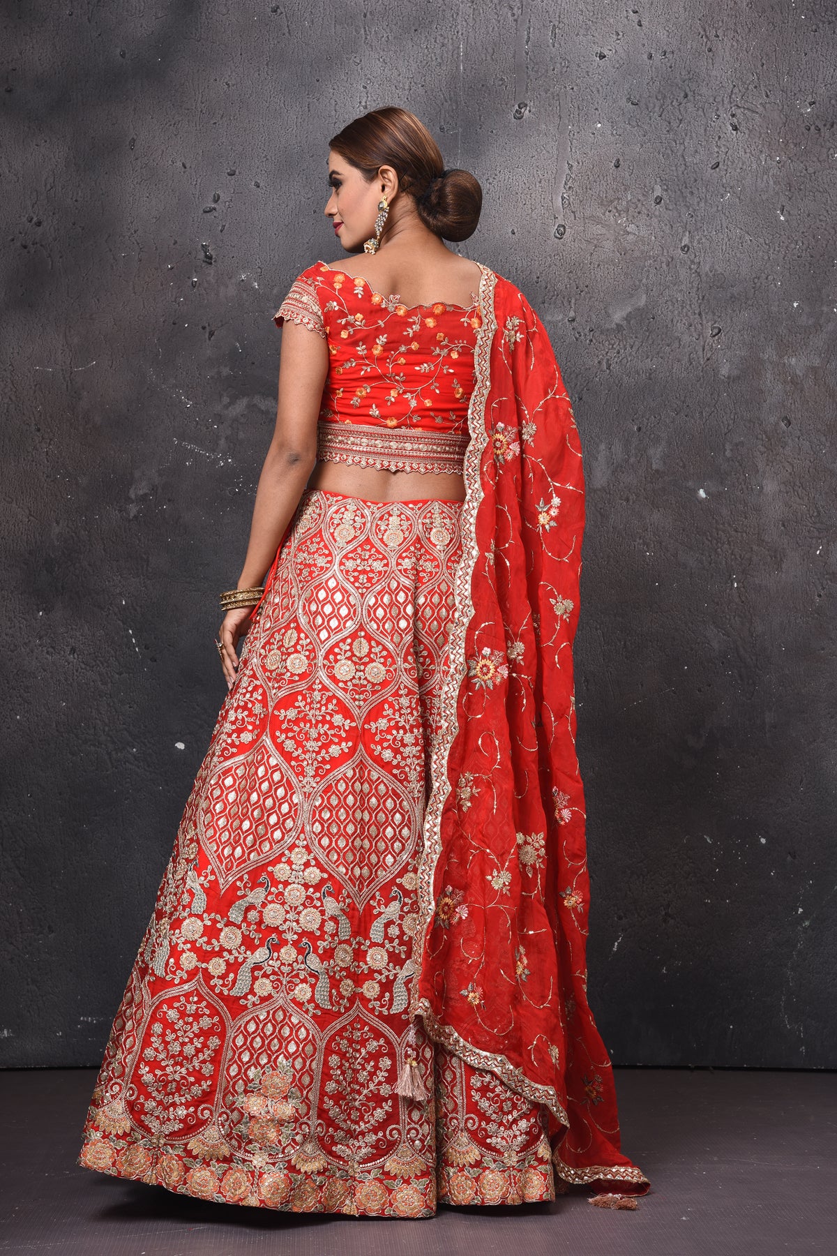 Shop beautiful red embroidered bridal lehenga online in USA with dupatta. Get set for weddings and festive occasions in exclusive designer Anarkali suits, wedding gown, salwar suits, gharara suits, Indowestern dresses from Pure Elegance Indian fashion store in USA.-back