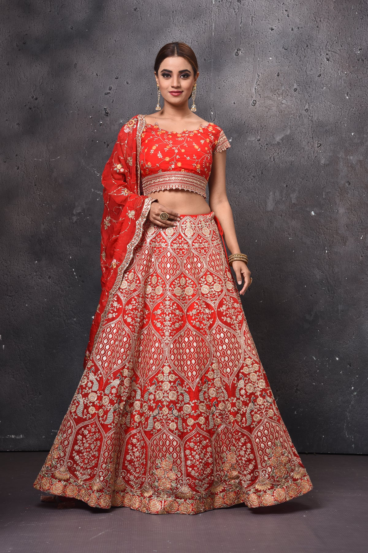 Shop beautiful red embroidered bridal lehenga online in USA with dupatta. Get set for weddings and festive occasions in exclusive designer Anarkali suits, wedding gown, salwar suits, gharara suits, Indowestern dresses from Pure Elegance Indian fashion store in USA.-full view