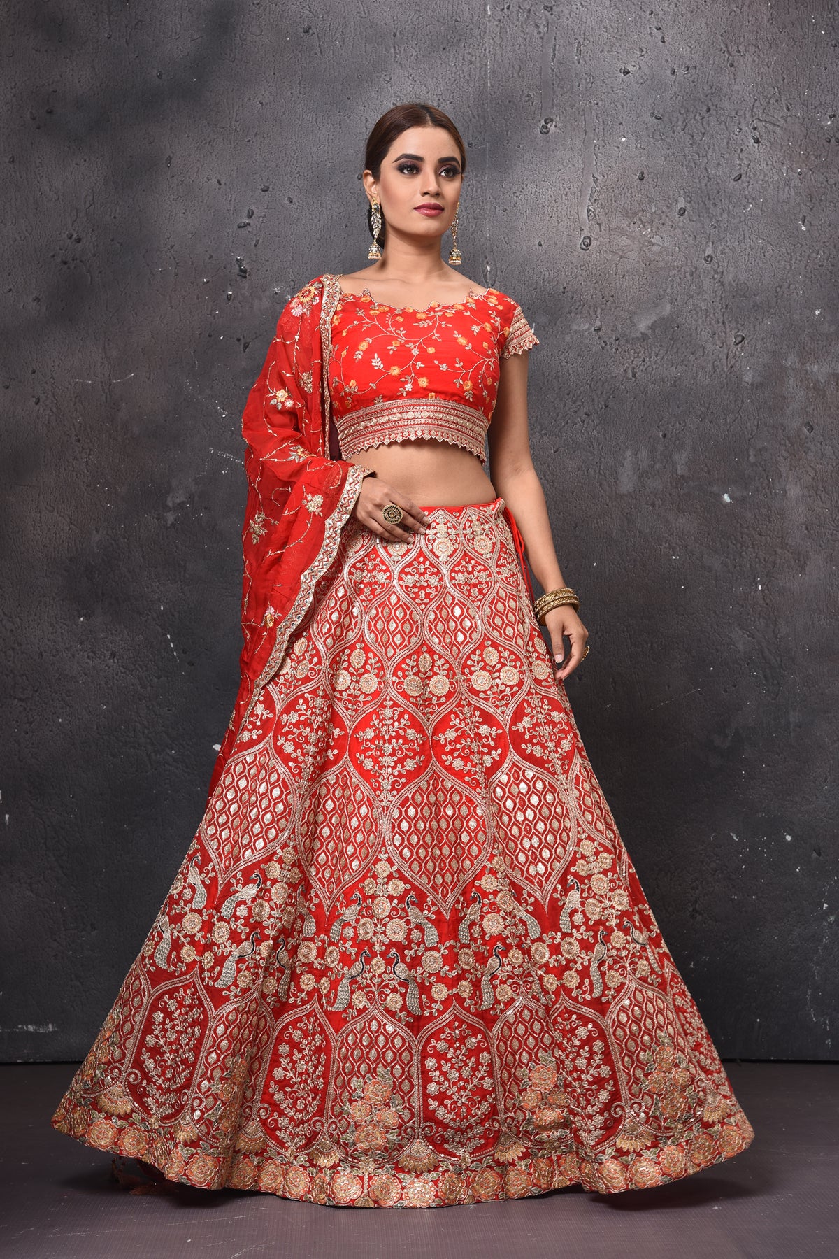 Shop beautiful red embroidered bridal lehenga online in USA with dupatta. Get set for weddings and festive occasions in exclusive designer Anarkali suits, wedding gown, salwar suits, gharara suits, Indowestern dresses from Pure Elegance Indian fashion store in USA.-front