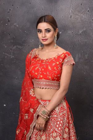 Shop beautiful red embroidered bridal lehenga online in USA with dupatta. Get set for weddings and festive occasions in exclusive designer Anarkali suits, wedding gown, salwar suits, gharara suits, Indowestern dresses from Pure Elegance Indian fashion store in USA.-closeup
