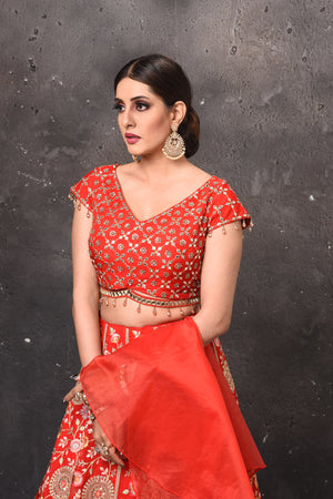 Buy beautiful red embroidered designer lehenga online in USA with fancy dupatta. Get set for weddings and festive occasions in exclusive designer Anarkali suits, wedding gown, salwar suits, gharara suits, Indowestern dresses from Pure Elegance Indian fashion store in USA.-closeup