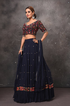 Buy beautiful navy blue and multicolor designer lehenga online in USA with dupatta. Get set for weddings and festive occasions in exclusive designer Anarkali suits, wedding gown, salwar suits, gharara suits, Indowestern dresses from Pure Elegance Indian fashion store in USA.-left