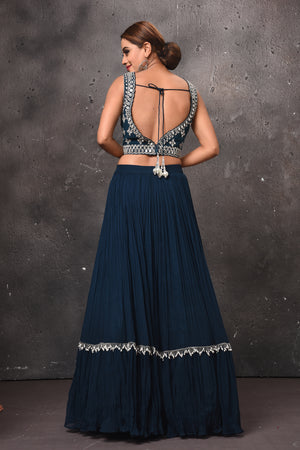 Shop stunning dark blue designer lehenga online in USA with ruffle dupatta. Get set for weddings and festive occasions in exclusive designer Anarkali suits, wedding gown, salwar suits, gharara suits, Indowestern dresses from Pure Elegance Indian fashion store in USA.-back