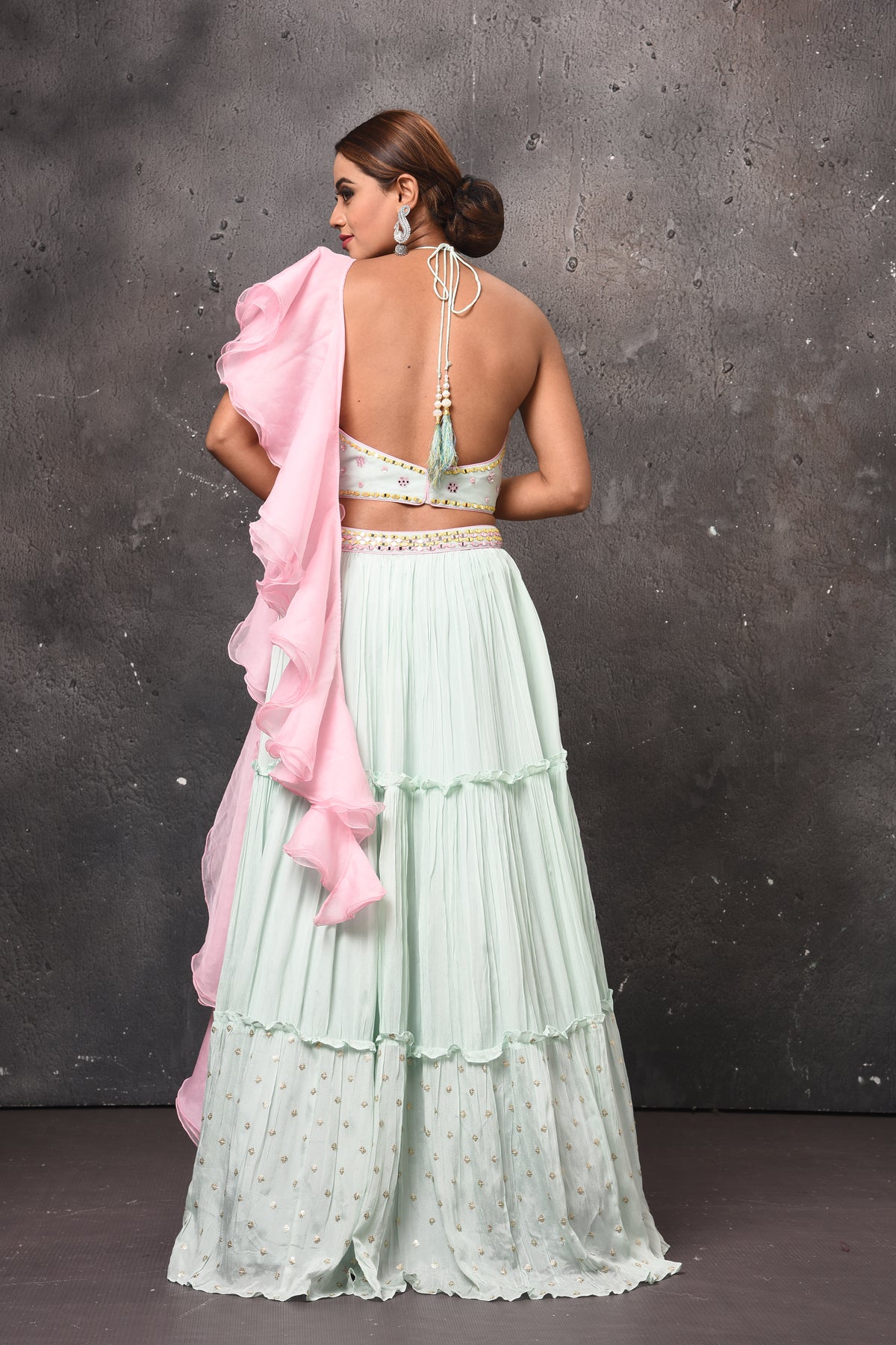 Shop beautiful mint green contemporary lehenga online in USA with pink ruffle dupatta. Get set for weddings and festive occasions in exclusive designer Anarkali suits, wedding gown, salwar suits, gharara suits, Indowestern dresses from Pure Elegance Indian fashion store in USA.-back