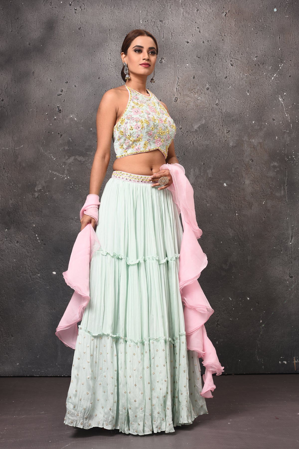 Shop beautiful mint green contemporary lehenga online in USA with pink ruffle dupatta. Get set for weddings and festive occasions in exclusive designer Anarkali suits, wedding gown, salwar suits, gharara suits, Indowestern dresses from Pure Elegance Indian fashion store in USA.-right