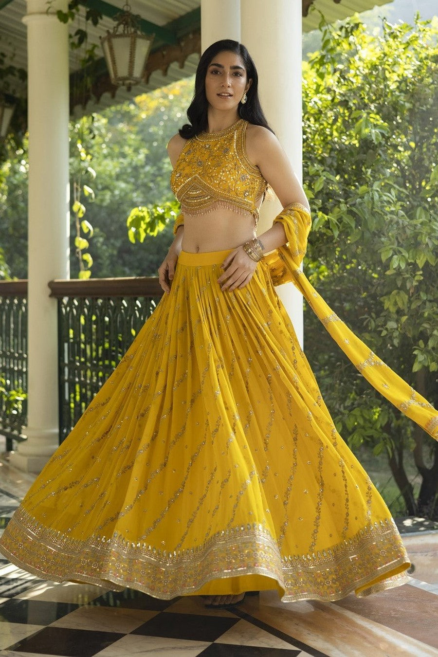 Shop stunning yellow embroidered ethnic lehenga online in USA with dupatta. Get set for weddings and festive occasions in exclusive designer Anarkali suits, wedding gown, salwar suits, gharara suits, Indowestern dresses from Pure Elegance Indian fashion store in USA.-full view