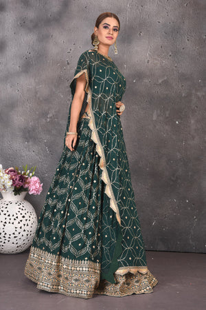 Buy stunning green embroidered skirt set online in USA with kaftaan blouse. Look stylish at parties and wedding festivities in designer dresses, Indowestern outfits, Anarkali suits, wedding lehengas, palazzo suits, sharara suits from Pure Elegance Indian clothing store in USA.-right