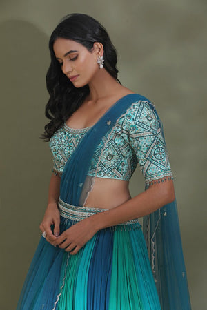 Shop stunning sea green and blue belted designer lehenga online in USA. Look your best at weddings and parties in Indian dresses, designer lehengas, Anarkali suits, designer gowns, salwar suits, sharara suits from Pure Elegance Indian fashion store in USA.-left