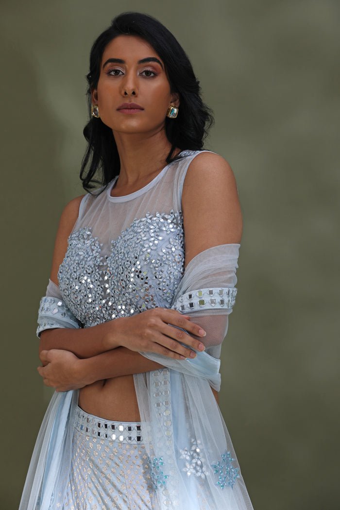 Buy beautiful powder blue embroidered lehenga online in USA with dupatta. Look your best at weddings and parties in Indian dresses, designer lehengas, Anarkali suits, designer gowns, salwar suits, sharara suits from Pure Elegance Indian fashion store in USA.-side
