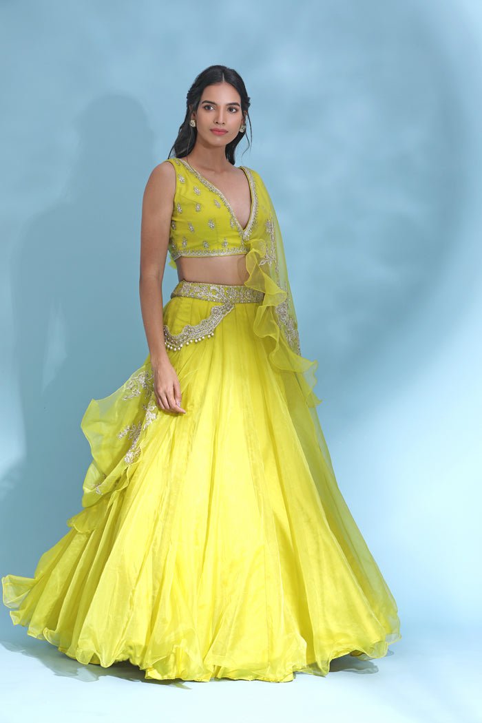 Buy stunning bright yellow embroidered designer lehenga online in USA with dupatta. Look your best at weddings and parties in Indian dresses, designer lehengas, Anarkali suits, designer gowns, salwar suits, sharara suits from Pure Elegance Indian fashion store in USA.-side