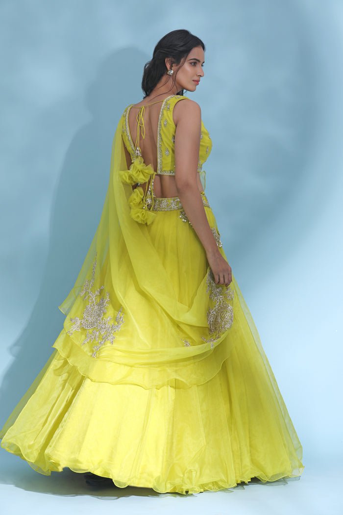 Buy stunning bright yellow embroidered designer lehenga online in USA with dupatta. Look your best at weddings and parties in Indian dresses, designer lehengas, Anarkali suits, designer gowns, salwar suits, sharara suits from Pure Elegance Indian fashion store in USA.-back