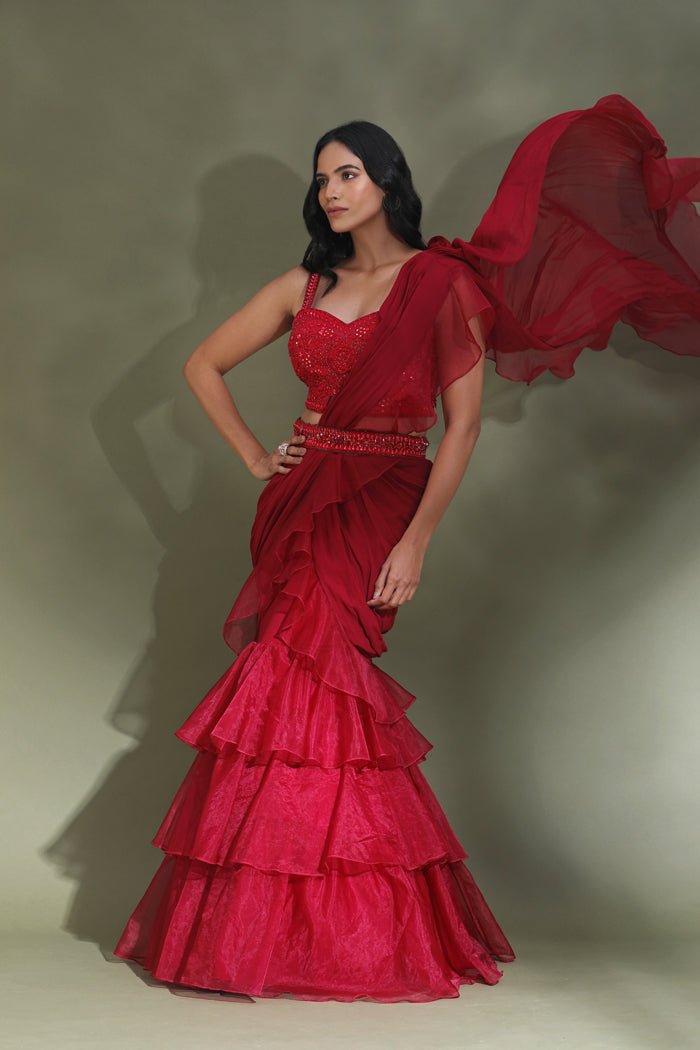 Shop beautiful blood red belted ruffle saree online in USA with designer blouse. Look your best at weddings and parties in Indian dresses, designer lehengas, Anarkali suits, designer gowns, salwar suits, sharara suits from Pure Elegance Indian fashion store in USA.-saree