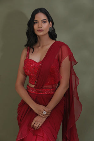 Shop beautiful blood red belted ruffle saree online in USA with designer blouse. Look your best at weddings and parties in Indian dresses, designer lehengas, Anarkali suits, designer gowns, salwar suits, sharara suits from Pure Elegance Indian fashion store in USA.-closeup