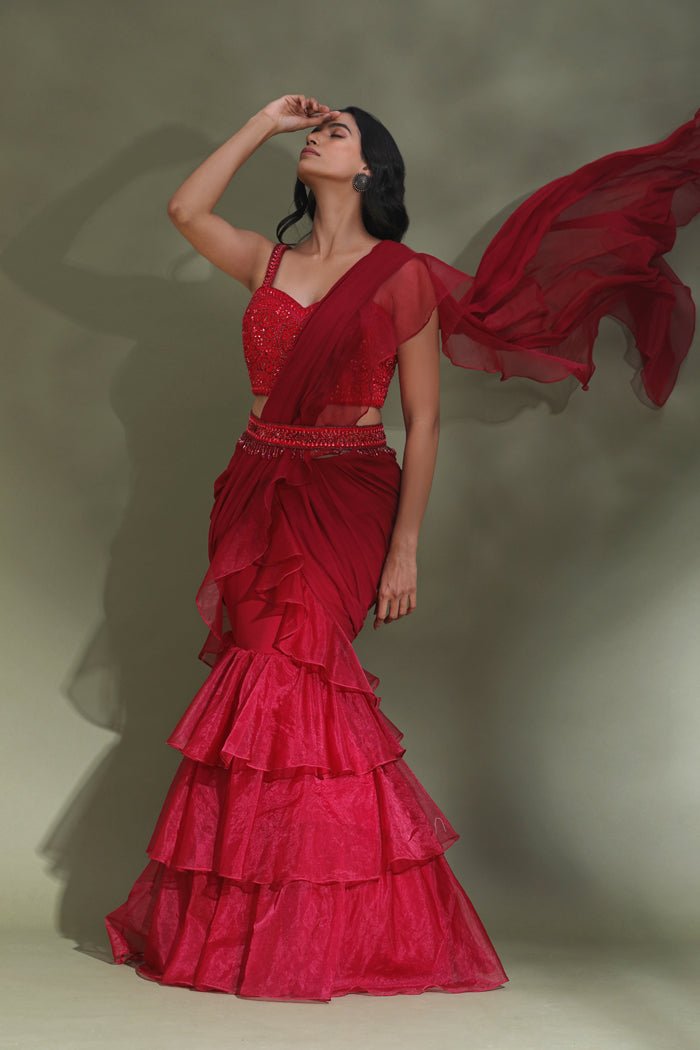 Shop beautiful blood red belted ruffle saree online in USA with designer blouse. Look your best at weddings and parties in Indian dresses, designer lehengas, Anarkali suits, designer gowns, salwar suits, sharara suits from Pure Elegance Indian fashion store in USA.-side